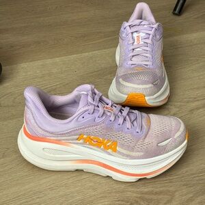 Hoka Bondi 9 running shoes in the "Aster Flower / Starlight Glow" colorway